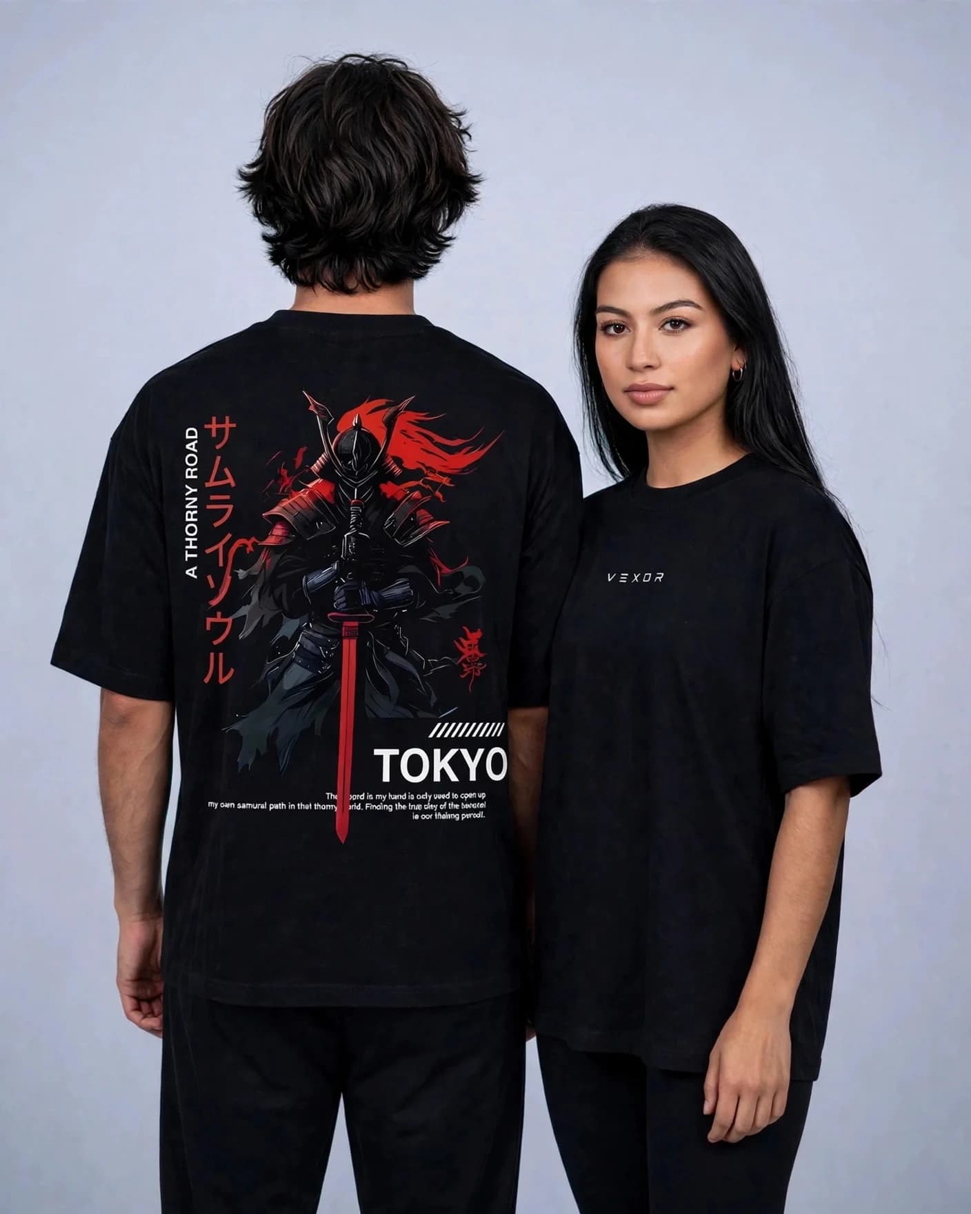 Two models in the black Thorny Road samurai oversized tee: one showing the back print, one showing the VEXOR chest logo
