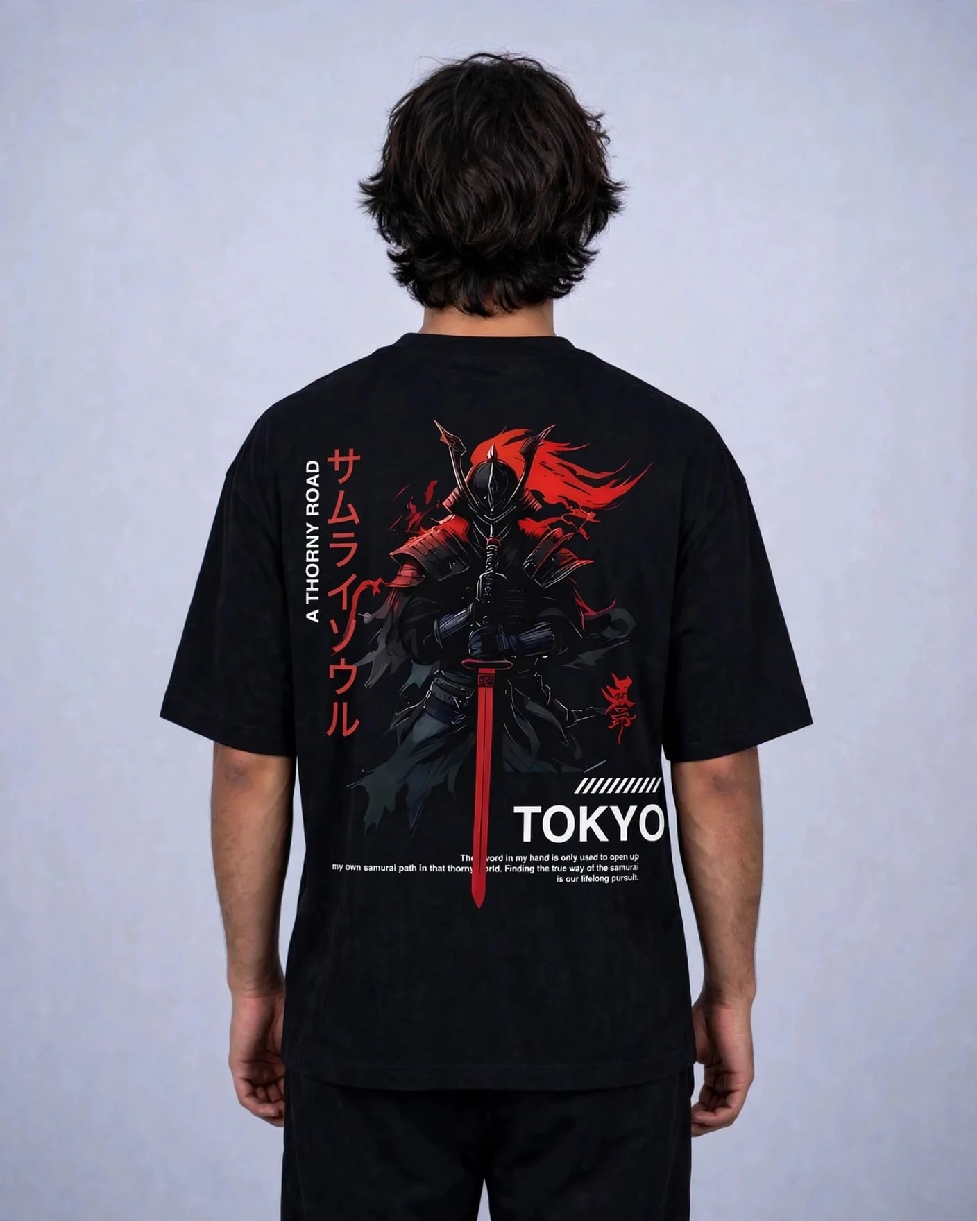 Man wearing the Thorny Road samurai oversized tee, back view showing the large red and white back print